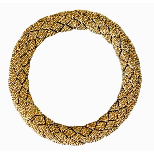 Ciner necklace composed of intricate links of beaded diamond shaped gold toned metal. Linked pieces are about an inch...