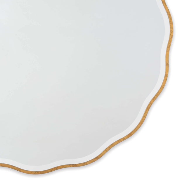 A soft, undulating frame gives this simple mirror modern glam detailing. Consider hanging this in a hallway or above a...