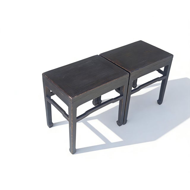 This pair of 19th century side tables feature a minimalist, architectural silhouette characteristic of late Qing Dynasty...