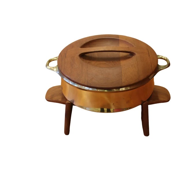 Jens Quistgaard Brass pot with lid and teak stand. Lid and legs in teak, branded 'Dansk Design Denmark' This piece has an...