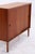 Vintage chest of drawers from Musterring with two smooth-running sliding doors and beautiful teak grain. Its clean lines...