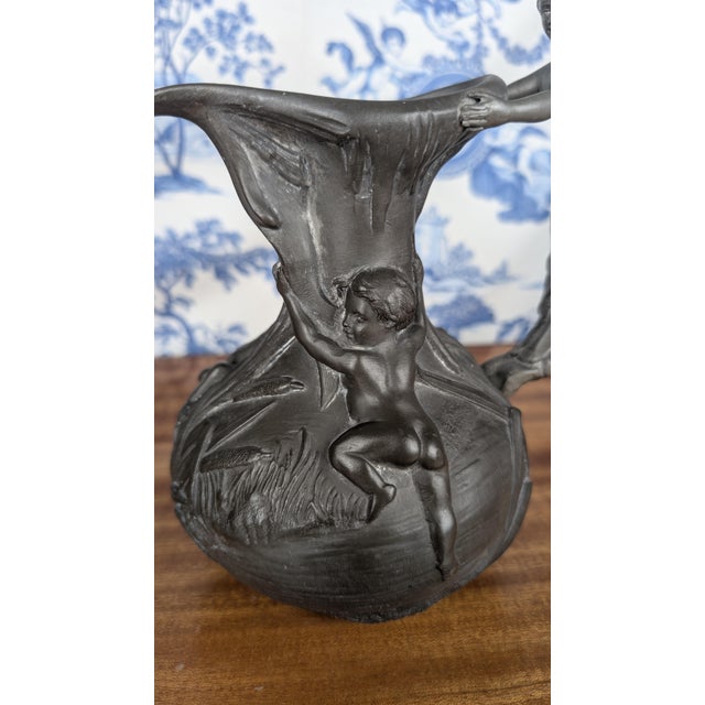 Art Nouveau pewter pitcher decorated with a woman and putti, signed Henri Huppé (1855-1911), late 19th century This...