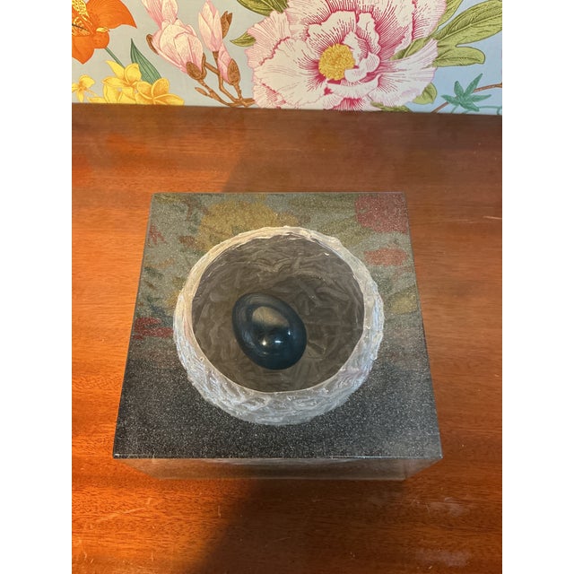 Beautiful Daum crystal nest featuring a delicately crafted egg, showcasing the brand’s signature artistry and attention to...