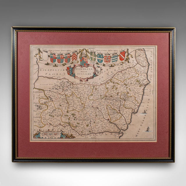 This is an antique county map of Suffolk. A Dutch, framed atlas engraving by Joan Blaeu, dating to the 17th century and...