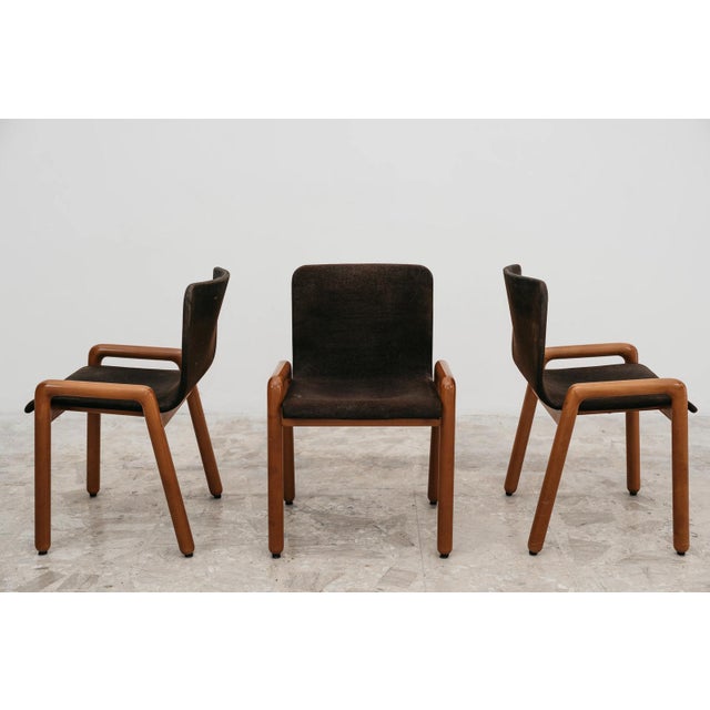 A rare and important set of three "Dilos" dining/office chairs with armrests, designed by renowned designer Guido...