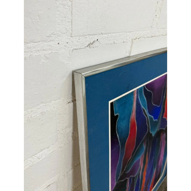 W25.5 H31.5 Abstract painting in red and cool shades by Ernesto Bonilla, with chrome frame.