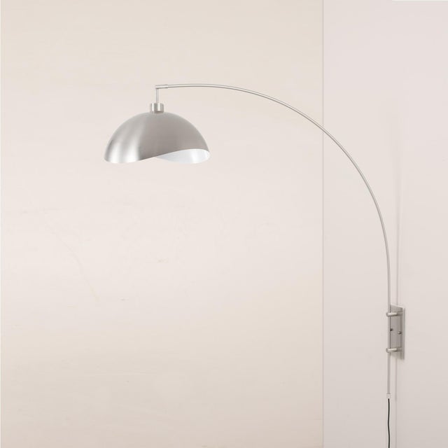 Featuring a sleek satin nickel finish, the Luna Bella Wall Arc Lamp is a sophisticated lighting solution with a half-dome...