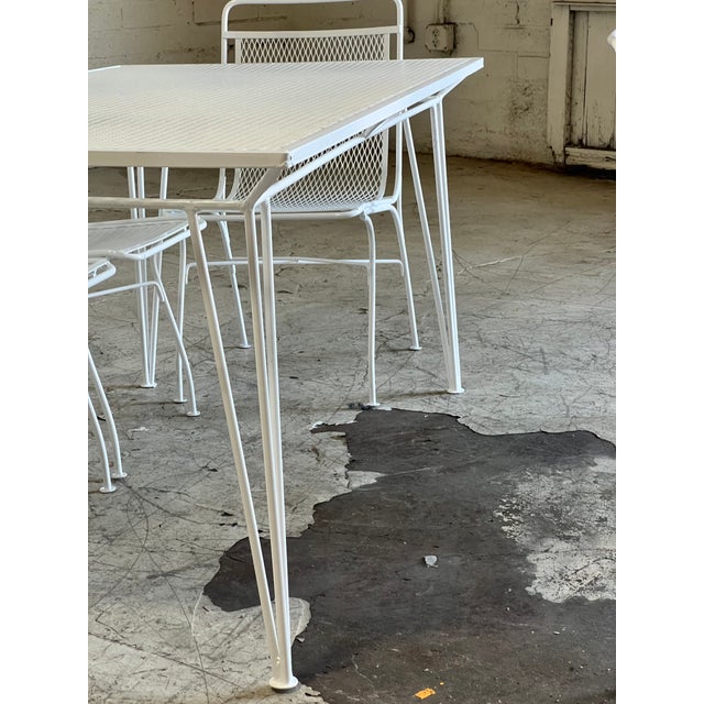 Newly powder coated wrought iron Salterini patio dining set featuring sleek modern metal mesh design on a rectangular...