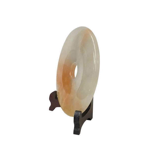 This round polished natural stone display is a unique and attractive accent piece for any home. The stone is polished to a...