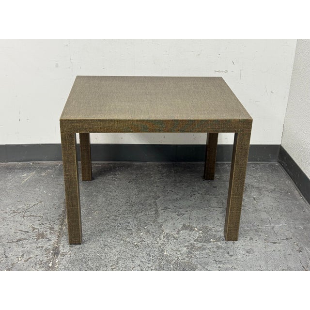 Design Plus Gallery presents an End Table with Linen Wrapped Exterior. The straight forward table is square with four...