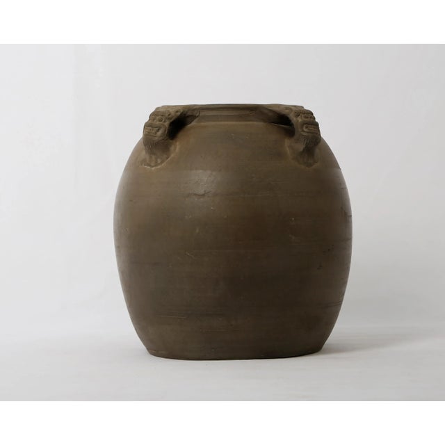 Introducing the Early 20th Century Vintage Gray Ceramic Pottery Vase featuring Four Lion Handles. Originating from...