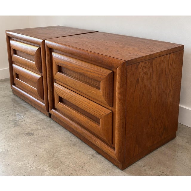 Vintage Bassett nightstands featuring a bold, sculptural form with deeply recessed drawer fronts and substantial framed...