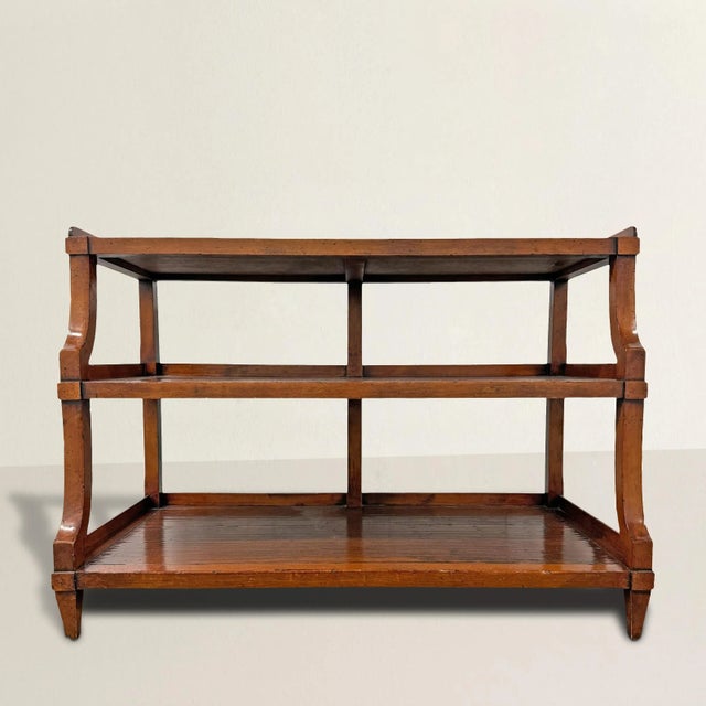 This charming early-20th century English yew wood console table is as versatile as it is stylish. Featuring three shelves...