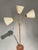 Striking Swedish Art Deco floor lamp from the 1940s, crafted in a refined combination of brass and teak. The design...