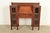 An outstanding antique Mission or Arts & Crafts side-by-side double bookcase cabinet with drop front secretary desk In the...