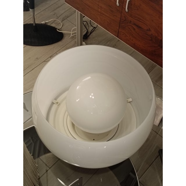 An elegant Mod. Omega table or ceiling lamp, designed by the master of Italian design Vico Magistretti and produced by...