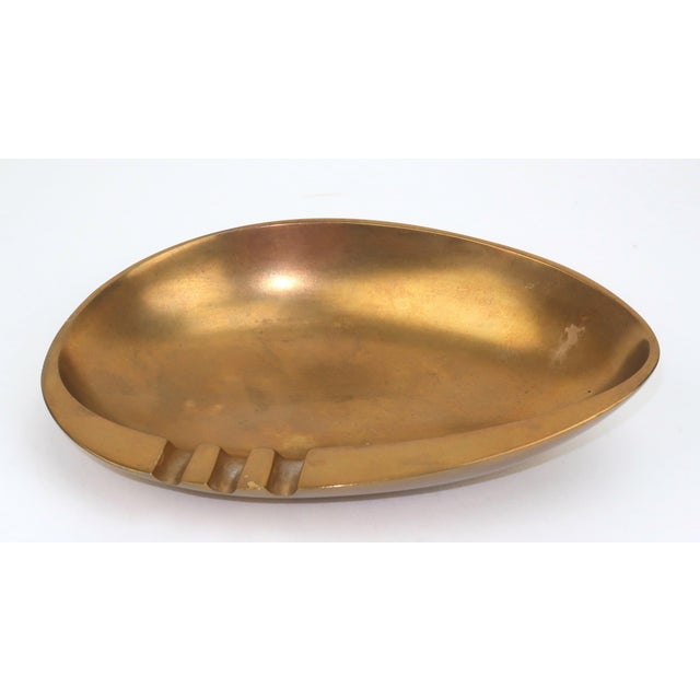 I don't like to promote smoking but every home needs a good ashtray...just in case. This C.1960 bronze ashtray with a...