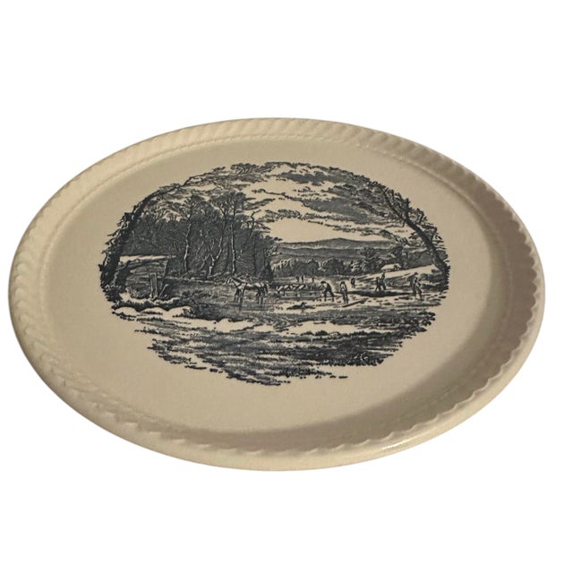 This decorative plate was produced by the Royal China Company of Sebring, Ohio, likely during the 1950s-1960s. It features...