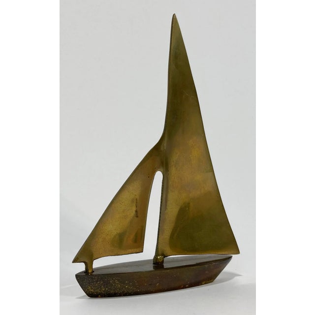 Vintage Mid Century Modern style brass sailboat with modern lines and full sails. Wonderful brass patina.
