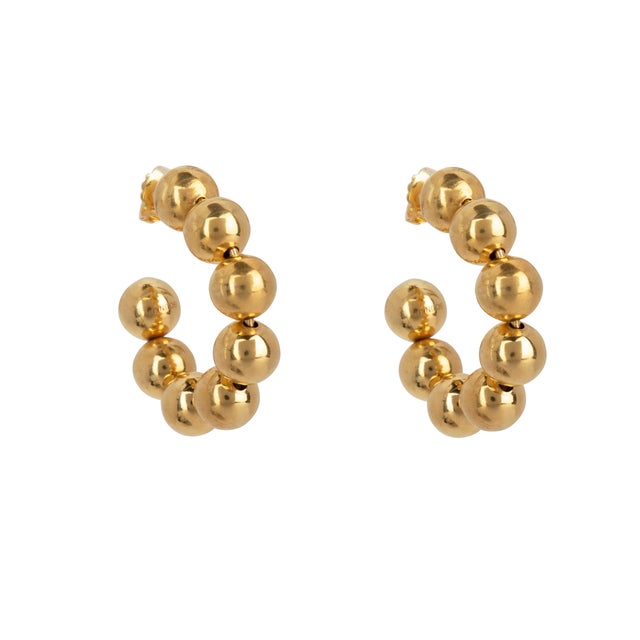 The Alexis Hoops, meticulously crafted from base metal and plated in 14k gold, boast a vintage and retro style with their...