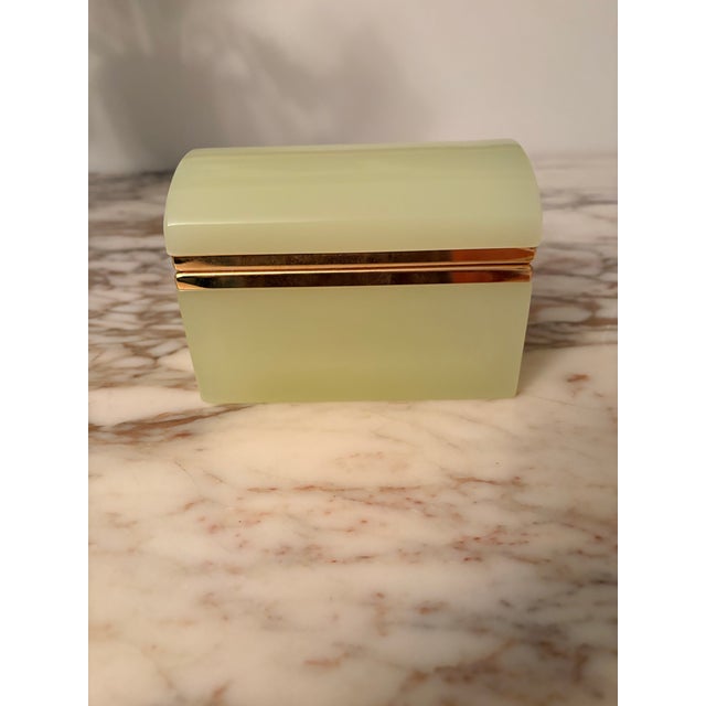 Gorgeous yellow opaline dome top casket with brass mount. Glows green under black light due to uranium. Nice smooth hinge,...