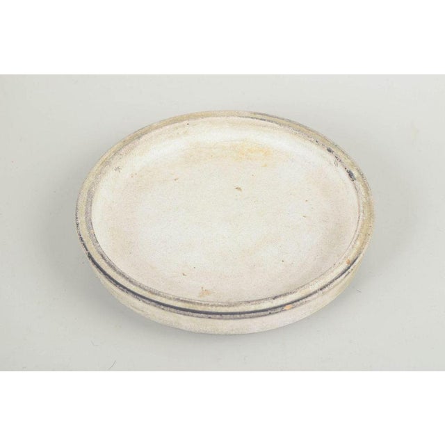 Svend Hammershøi for Kähler Low bowl / dish, 1930s. Low, circular stoneware bowl with a restrained architectural form and...