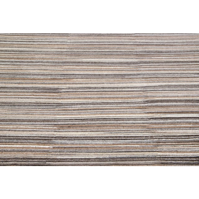 Beautiful Apadana's handmade bamboo & silk Indian groove rug with beige, gray, and brown colors field. This groove...