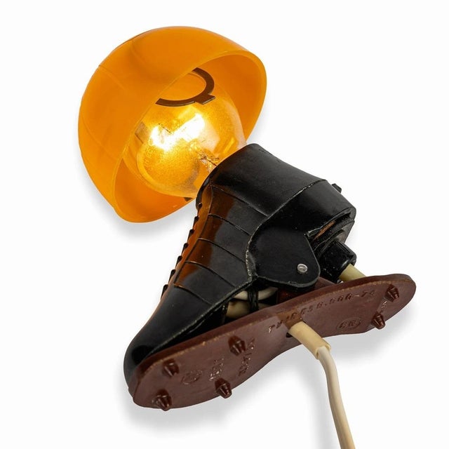 Bakelite lamp in the shape of a football. The top of the lamp is shaped like a football and fits directly onto an E14...