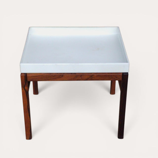 Swedish rosewood planter stand with removable tray, circa 1960s. The elegant frame highlights the natural grain of the...