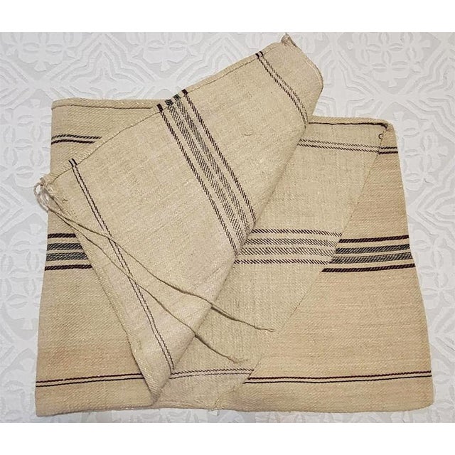 This antique European grain sack is handwoven from heavy, high-quality natural hemp or linen. It features a beautiful,...
