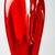 Crafted from red Murano glass with transparent edges, this piece features a narrow base that widens into a wavy cone at...