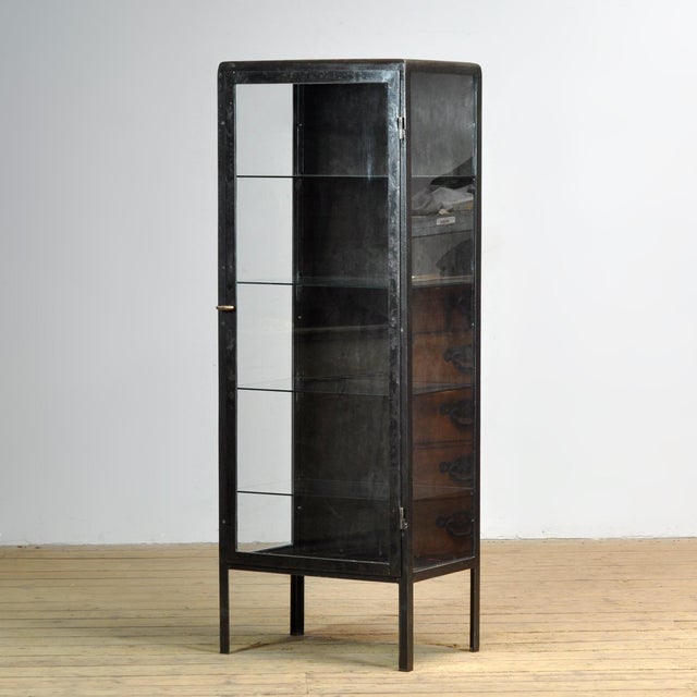 Medicine cabinet from the 1920s. This cabinet is made of iron and glass, creating a rugged industrial look. The cabinet...