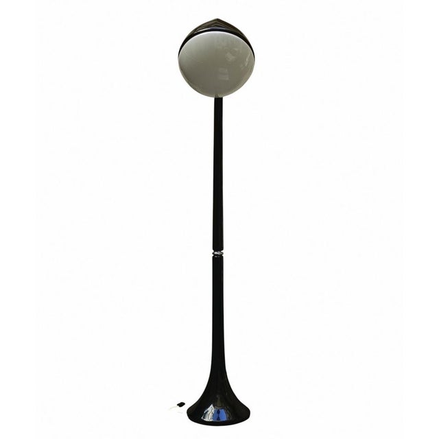 Lampione floor lamp, designed by Fabio Lenci for Guzzini in 1968. The Lampione lamp features an elegant stem made of black...