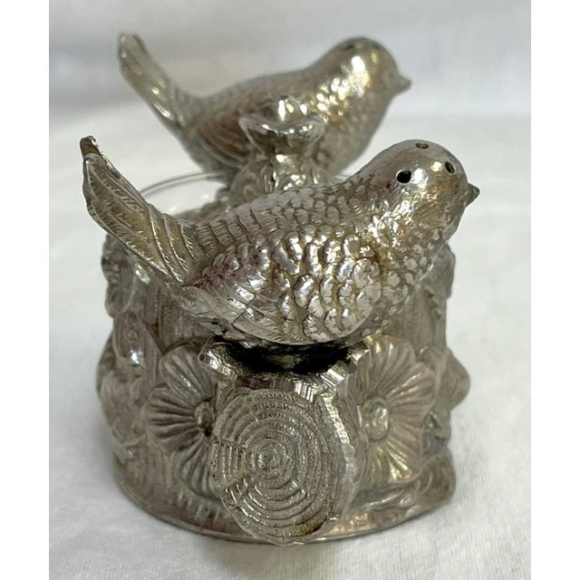 Adorable vintage set of salt and pepper shakers with lidded salt cellar. The set is made of silverplated metal and depicts...