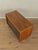 A wonderful sideboard from the 1950s. The body is made of teak veneer with two cabinet doors, four shelves, and new black...