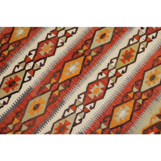 One of a kind, hand knotted Turkish tribal Kilim flat-weave from the second quarter of the 20th century with a rustic all-...