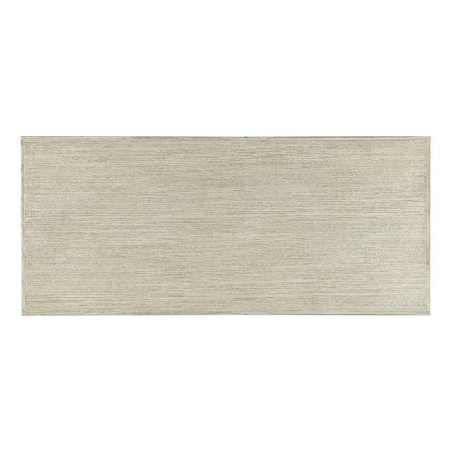 A rectangular top rests over four squared corner posts joined by a middle and low shelf elevated on tapering legs. Care...