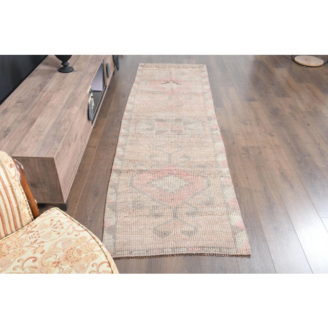 Vintage Turkish Hand-Knotted vintage rug is a semi- vintage runner rug.'70s Eastern region of Turkey's unique rug is...