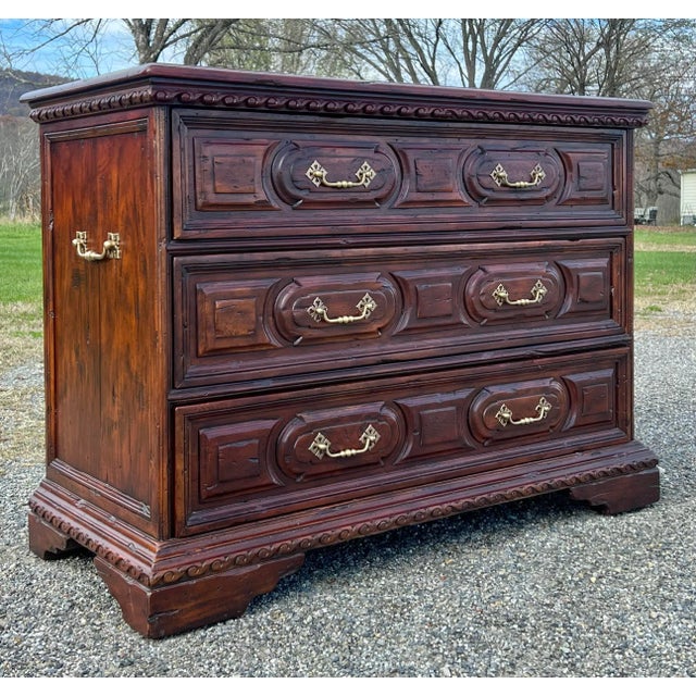 Impressive rustic European three drawer mahogany commode by Theodore Alexander. Nicely carved rope detail below the top as...