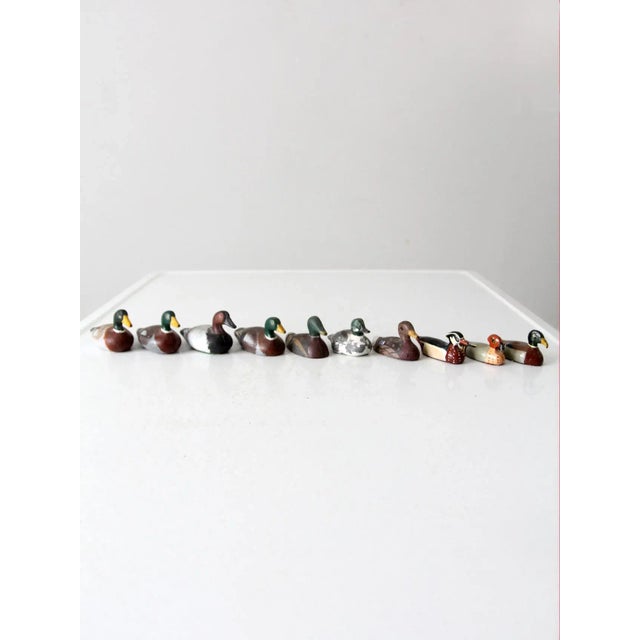 This is a collection of ten vintage cast iron duck figurines circa 1930s-1960s. Each piece is hand-painted and reflects a...