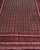 The field of this hand-knotted Afghan Turkmen rug is nearly black — a very deep midnight navy — filled wall to wall with...