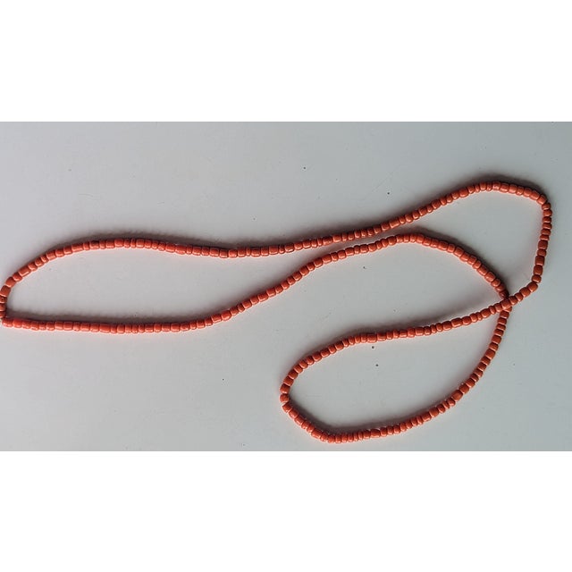 Antique 43" strand necklace without a clasp. The shapes are mainly "oval" alternating with round to flat like beads. All...
