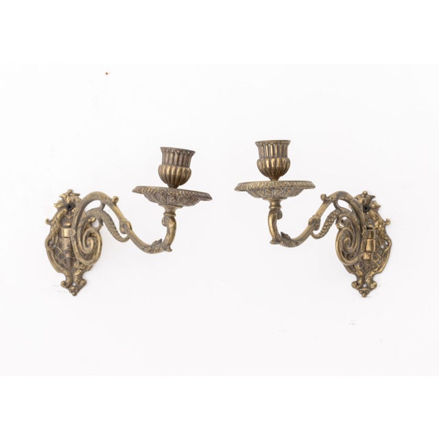 Pair of French Empire Style Brass Swing-Arm Wall Sconces. Fully extended: 5.75" H x 9" W x 3" D. Provenance: From an East...