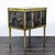 This cabinet features a distressed yellow finish and unique metal-paneled doors with perforated floral patterns. The...