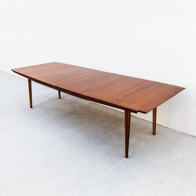 Richard Thompson's walnut extension dining table, designed for Glenn of California in the 1960s, is one of our favorites....