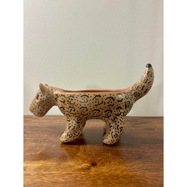 Sculptural handmade ceramic jaguar bowl created by Indigenous Waujá (Waurá) artisans of Brazil. The vessel is modeled in...