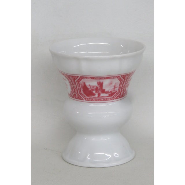 This charming Goblet Vase is made out of porcelain. This lovely vessel is marked on the bottom as being made by "Heinrich...