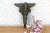 A robust utilitarian antiquity featuring a detailed geometric stem and a stylized architectural bud finial, carrying a...