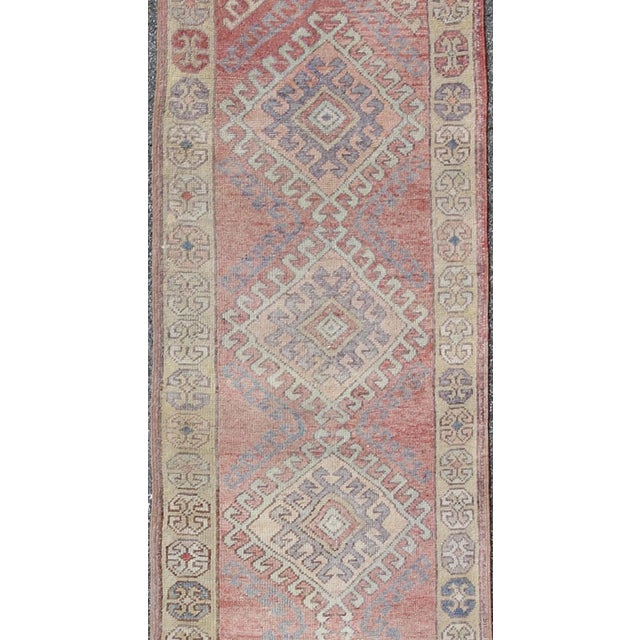 Measures: 2'11 x 14'3 Vintage Turkish Oushak Runner in Soft Rose, Pale Blue, and Faded Ivory. Keivan Woven Arts / rug...