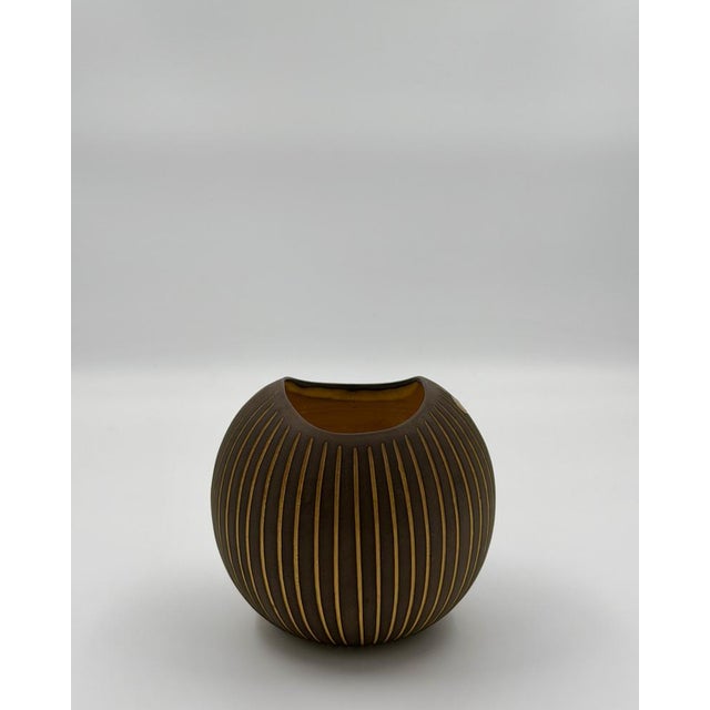 This iconic "Kokos" (Coconut) vase was designed by the renowned Swedish ceramicist Hjördis Oldfors for Upsala-Ekeby in...